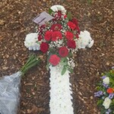 Red White cross - White Chrysanthemum base, red roses and carnation spray.