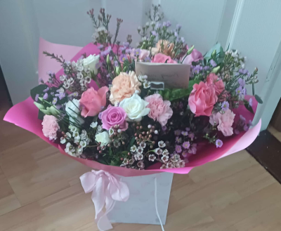 Blush Harmony - A pink and white flower bouquet with roses, seasonal blooms and fresh greenery. Hand-tied and perfect for any occasion.