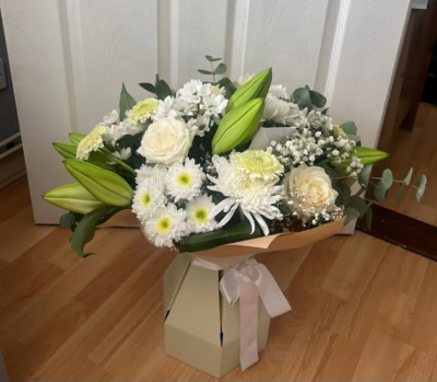 Pure Elegance - Pure Elegance – A white flower bouquet with roses, lilies and seasonal blooms. Hand-tied, elegant and perfect for any occasion.