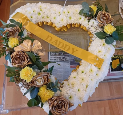 Golden Heart Tribute - Golden Heart Tribute – A white and gold heart-shaped funeral tribute with roses, chrysanthemums and foliage. Personalised and deeply meaningful.